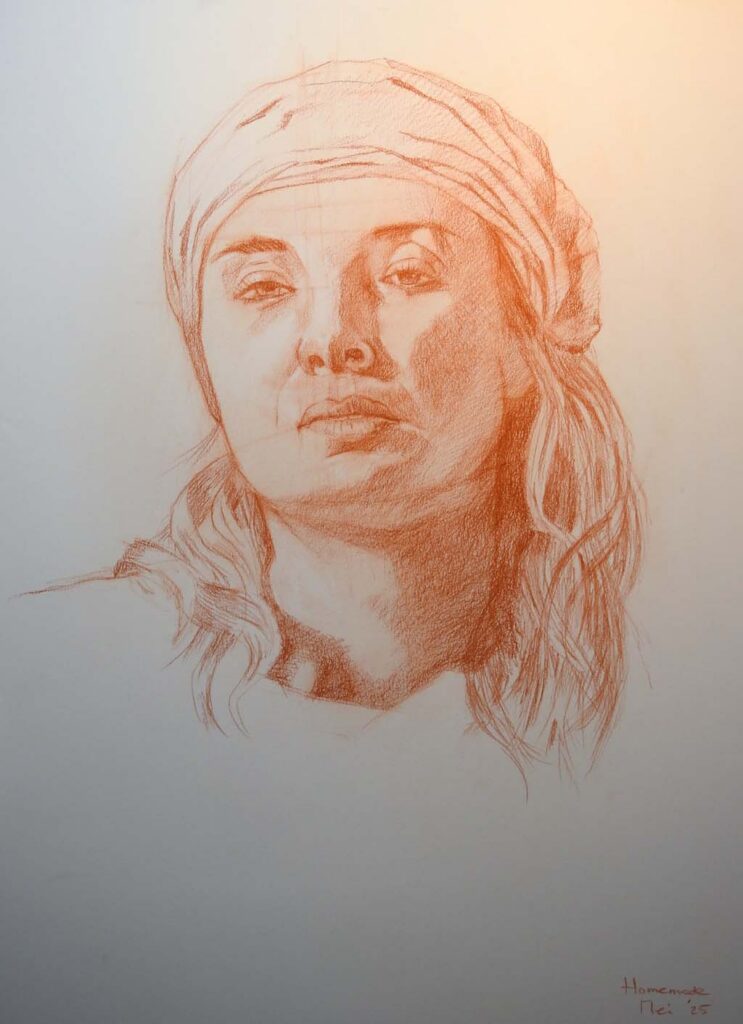 Op wit papier getekend vrouwenhoofd. Naar een foto van NMA en getekend met Sanguine (droog) potlood van Creta Color